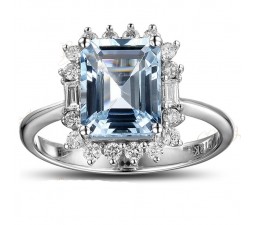 Beautiful 1.50 Carat blue topaz and diamond halo engagement ring in white gold