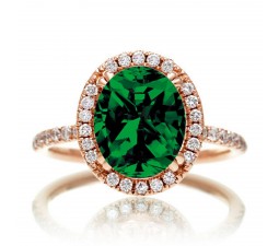 1.5 Carat Oval Classic Emerald and diamond halo ring on 10k Rose Gold
